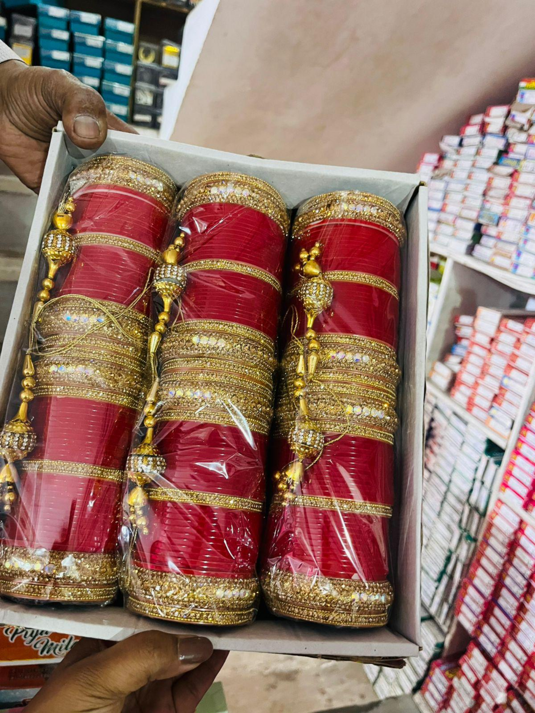Red and gold wrapped items in a box